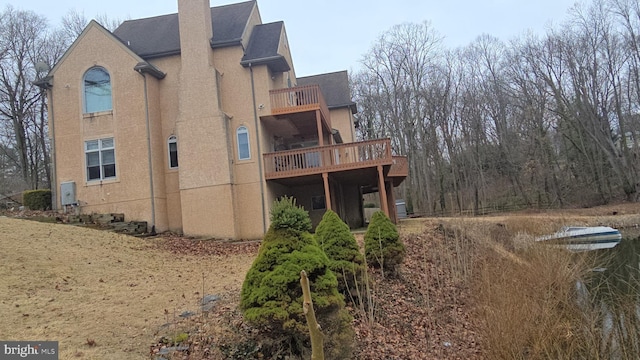 view of side of property with a chimney