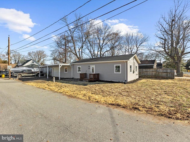 view of front of property with a garage, a chimney, and fence