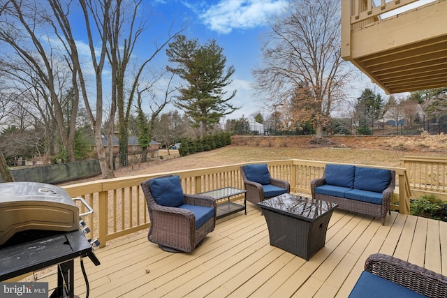 wooden deck with area for grilling, outdoor lounge area, and fence