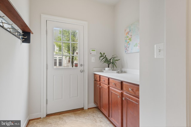 doorway with baseboards