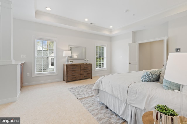 bedroom with baseboards, a raised ceiling, light colored carpet, and recessed lighting