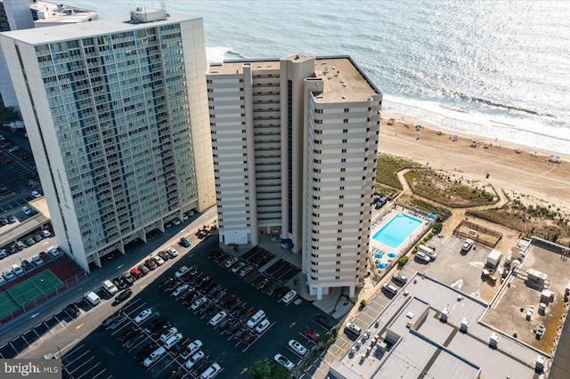 birds eye view of property with a beach view and a water view