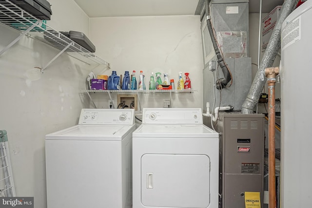 clothes washing area with laundry area and independent washer and dryer