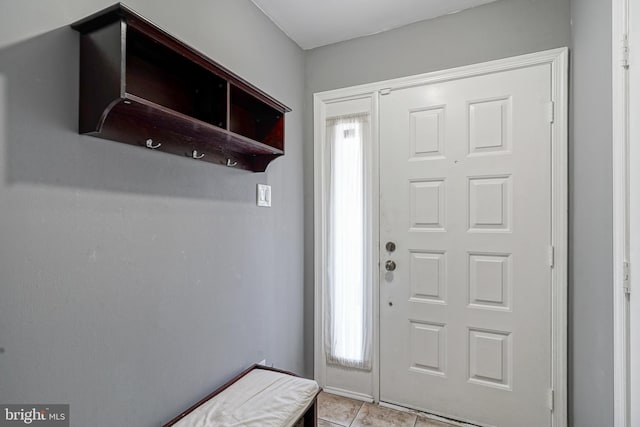 foyer entrance with tile patterned floors