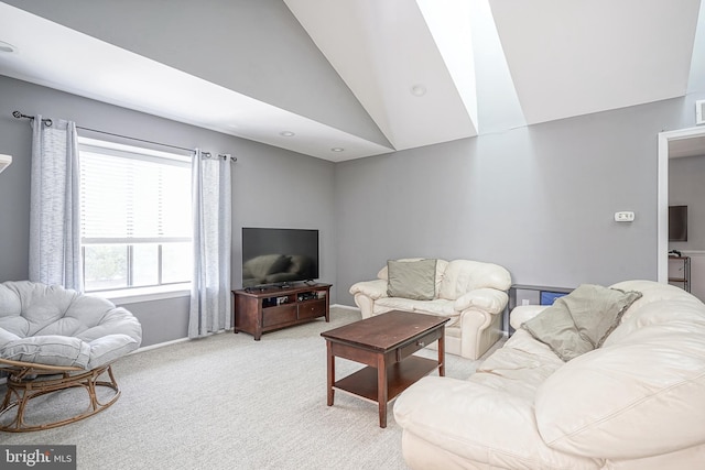 living area with light carpet and lofted ceiling