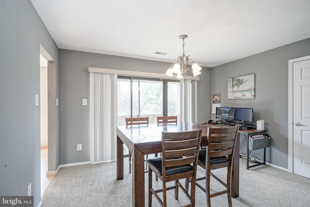 dining area featuring visible vents, light colored carpet, baseboards, and an inviting chandelier