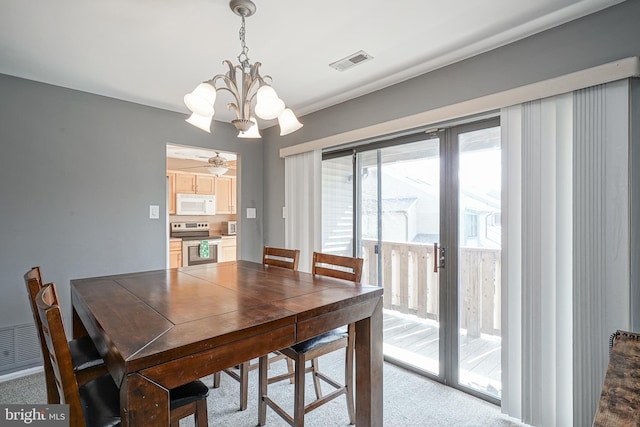 dining area with a notable chandelier and visible vents