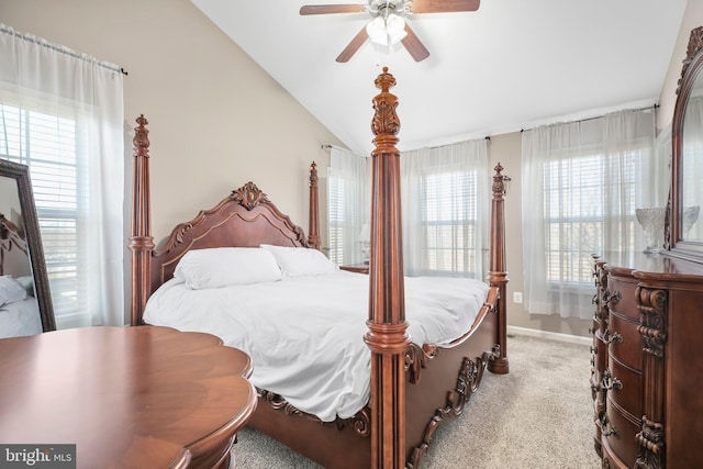 bedroom with vaulted ceiling, carpet, baseboards, and ceiling fan