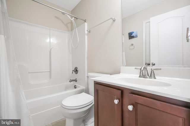 full bathroom featuring shower / tub combo, toilet, and vanity