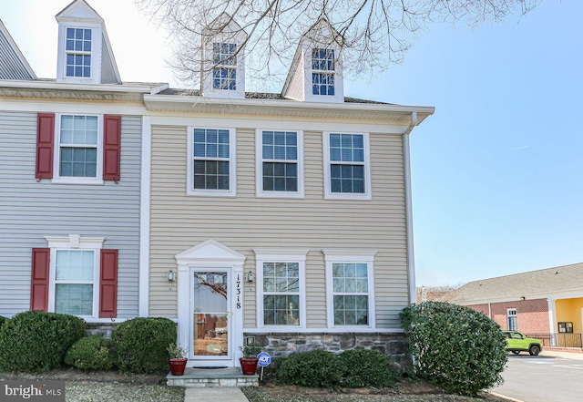 townhome / multi-family property with stone siding