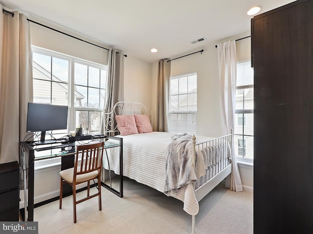 bedroom featuring recessed lighting, light colored carpet, visible vents, and baseboards