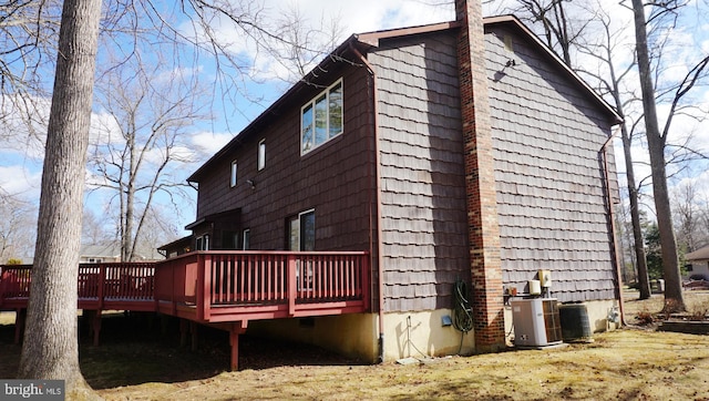 view of side of property with a deck