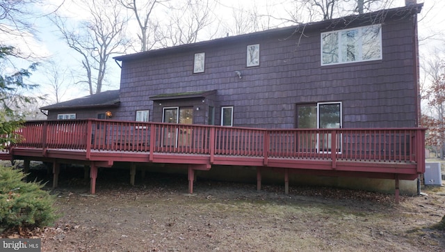 rear view of property with a wooden deck