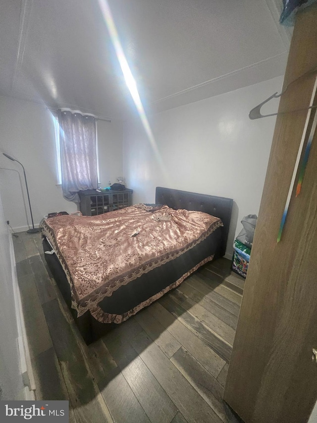 bedroom with hardwood / wood-style floors