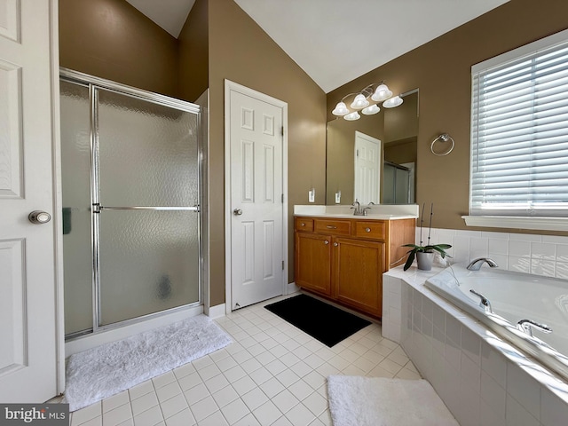 bathroom with vanity, vaulted ceiling, a shower stall, tile patterned floors, and a bath