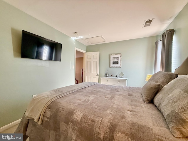 carpeted bedroom featuring visible vents and baseboards