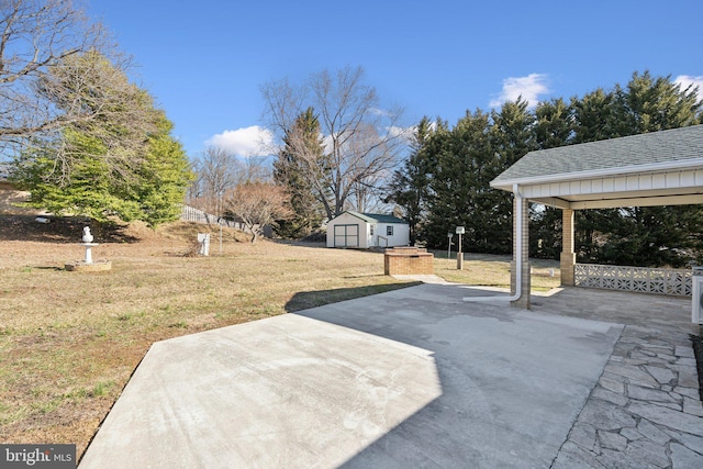 view of patio / terrace featuring a storage shed and an outdoor structure