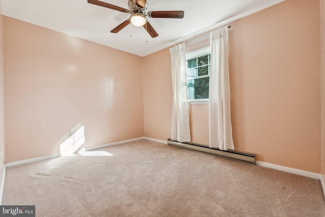 carpeted empty room featuring a baseboard radiator, baseboards, and a ceiling fan