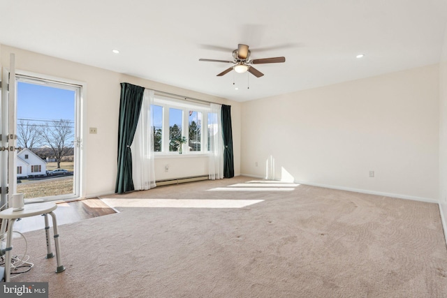 carpeted empty room with recessed lighting, baseboards, a ceiling fan, and a baseboard radiator