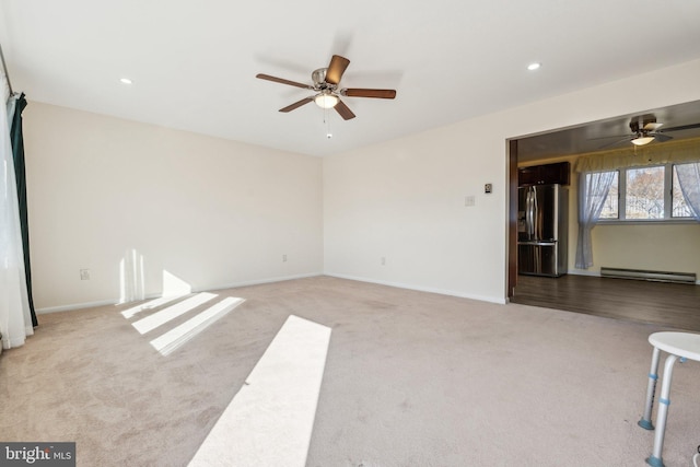 empty room with baseboards, carpet, baseboard heating, recessed lighting, and a ceiling fan