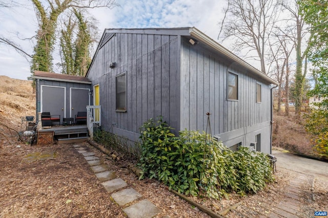 view of home's exterior featuring an outbuilding