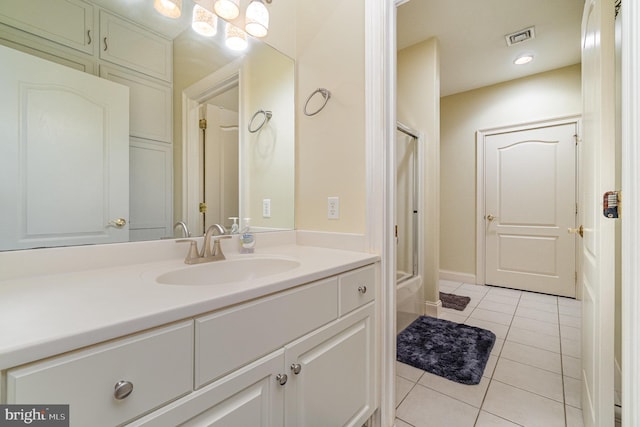 bathroom featuring visible vents, vanity, and tile patterned floors