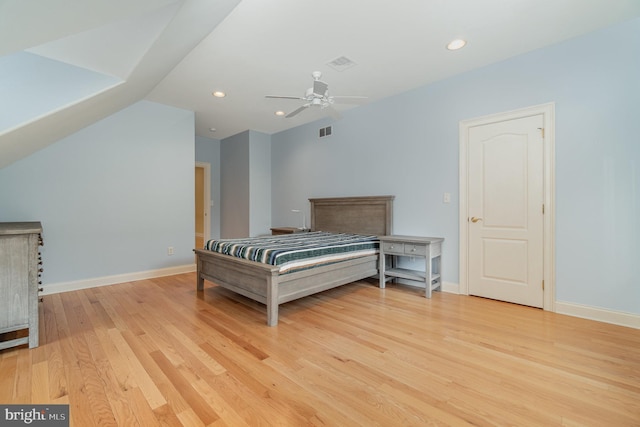 bedroom featuring light wood-type flooring, visible vents, and baseboards