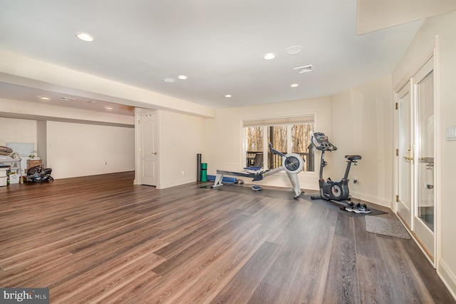 workout room with recessed lighting, visible vents, baseboards, and wood finished floors