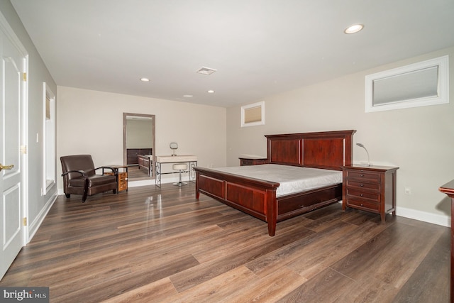 bedroom featuring recessed lighting, visible vents, baseboards, and wood finished floors