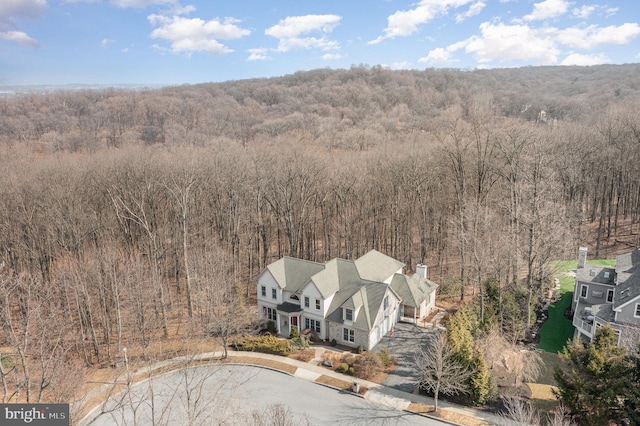 aerial view featuring a view of trees