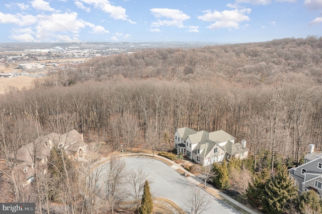 drone / aerial view featuring a view of trees