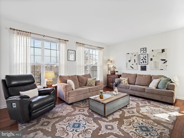 living room featuring baseboards and wood finished floors