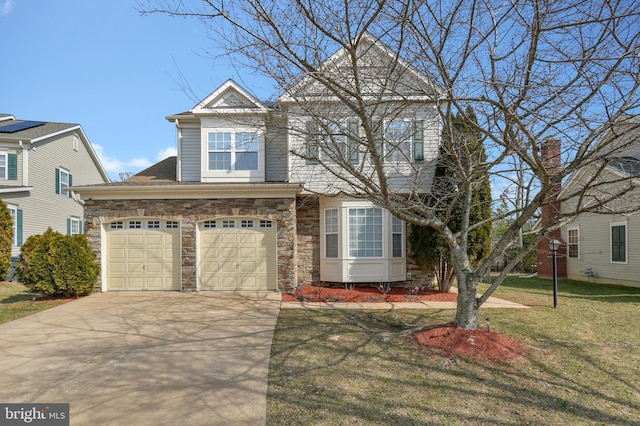 view of front of property with a garage, a front lawn, concrete driveway, and stone siding