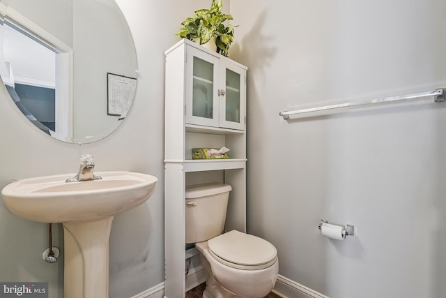 bathroom featuring toilet