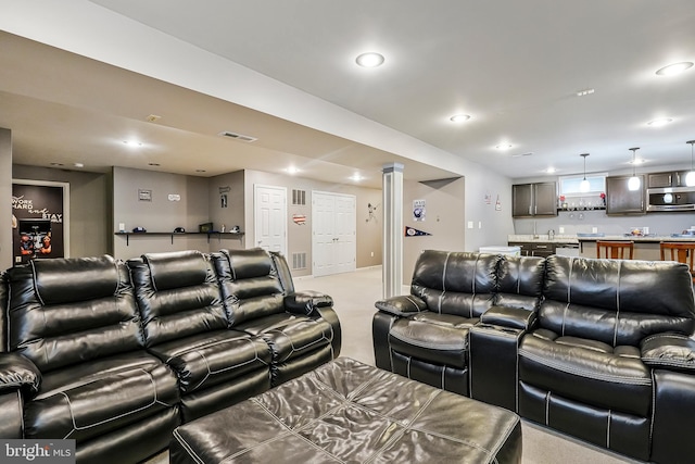 cinema room featuring indoor wet bar and recessed lighting