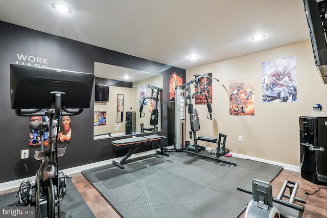 exercise room featuring recessed lighting and baseboards