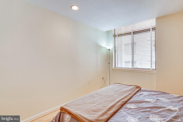 bedroom with recessed lighting and baseboards