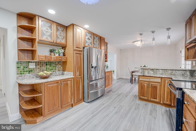 kitchen featuring brown cabinets, light wood finished floors, open shelves, stainless steel appliances, and hanging light fixtures