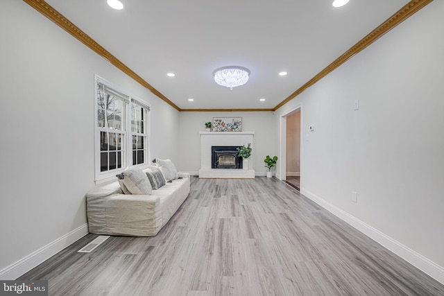 living room with a fireplace, recessed lighting, wood finished floors, and baseboards