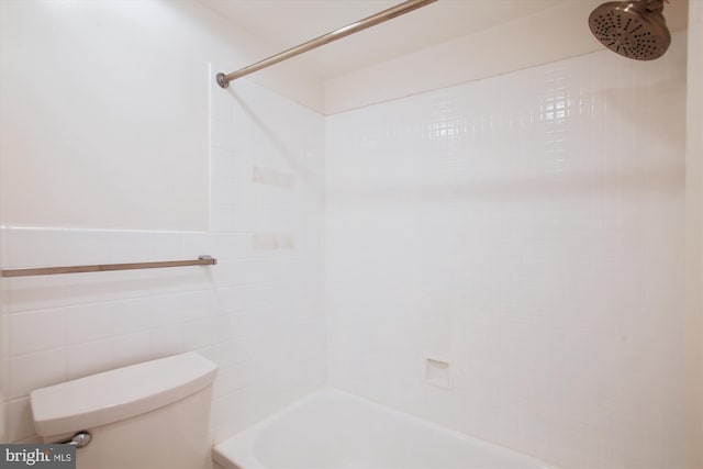 full bathroom with toilet, shower / tub combination, and tile walls