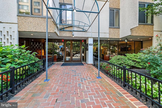 property entrance featuring stucco siding