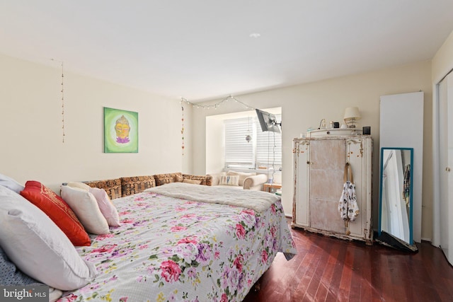 bedroom featuring wood finished floors