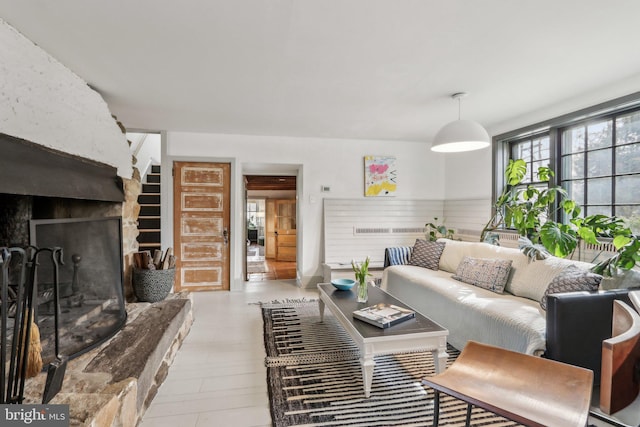 living area featuring a large fireplace