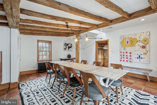 tiled dining space featuring baseboards, beamed ceiling, visible vents, and radiator