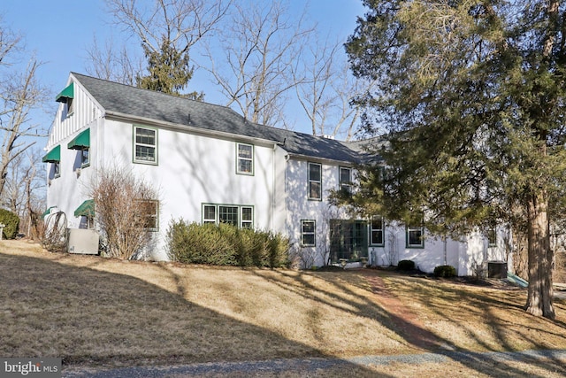 view of front of property featuring a front lawn and board and batten siding