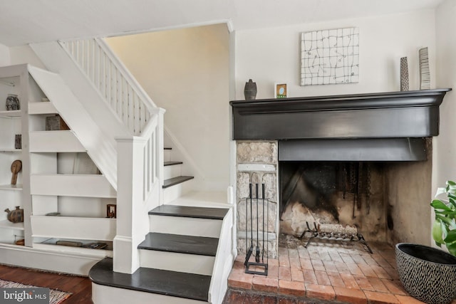 staircase with a fireplace