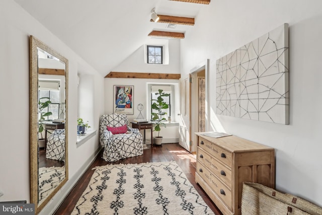 sitting room featuring lofted ceiling, dark wood-type flooring, and baseboards