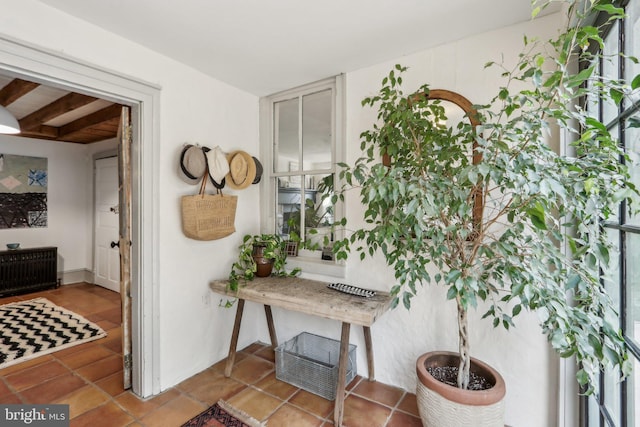 interior space featuring radiator heating unit and tile patterned flooring