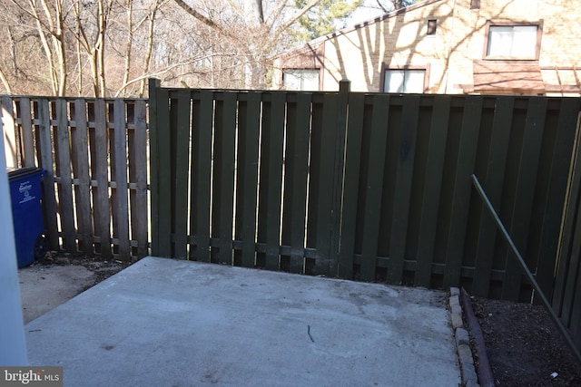 view of gate with fence