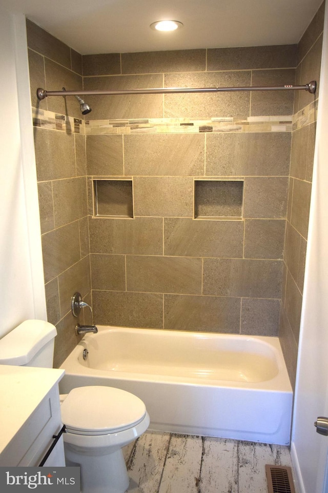 full bath with toilet, shower / bathing tub combination, vanity, and visible vents